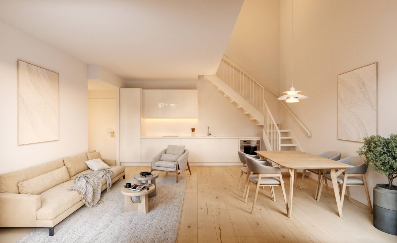 Salón con cocina integrada en ático de la promoción Ermita 44